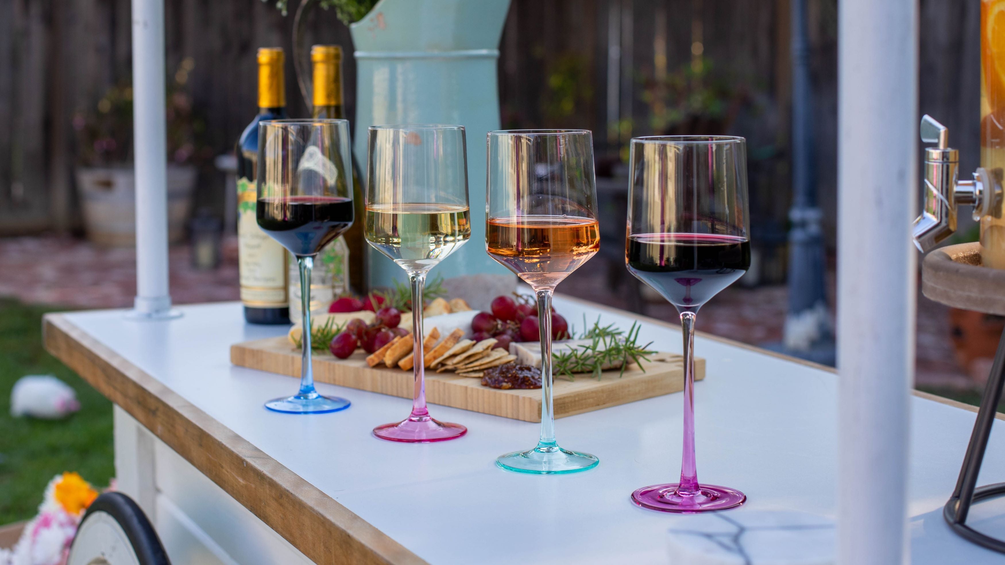 Colored wine glasses and cheese board